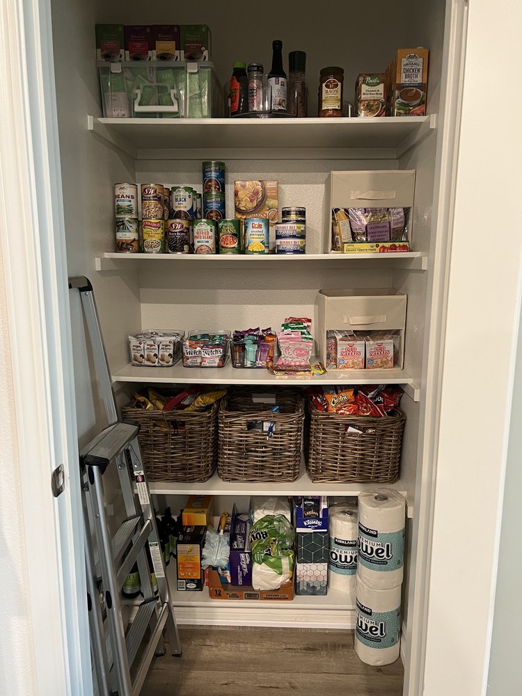 Well-organized pantry with clear containers, labeled shelves, grouped categories, and easy access to all items