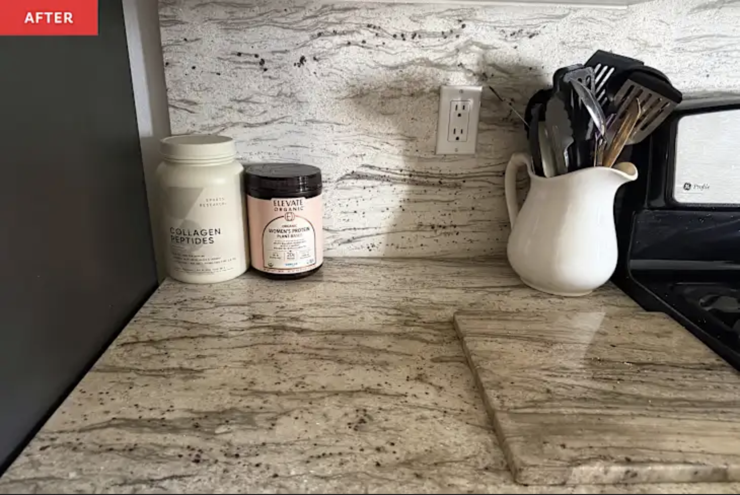 Clutter-free kitchen countertop with granite backsplash